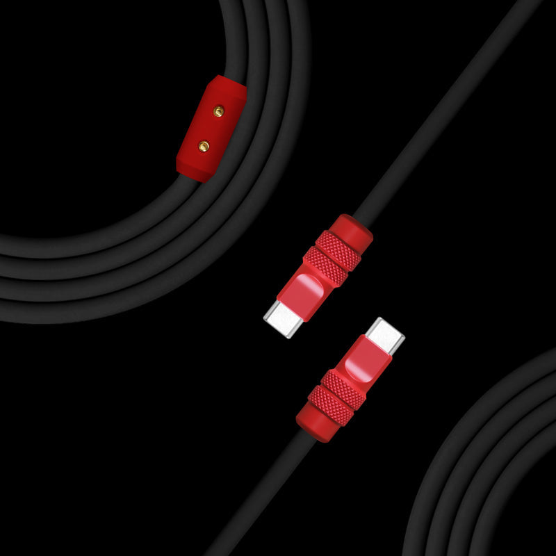 Close-up of black USB-C to USB-C cable with red knurled connectors
