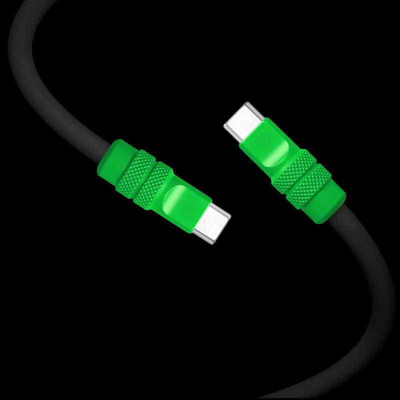 Close-up of a durable black silicone dual USB-C cable with green grips.