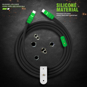 Coiled black silicone charger cable with green details on a dark background.