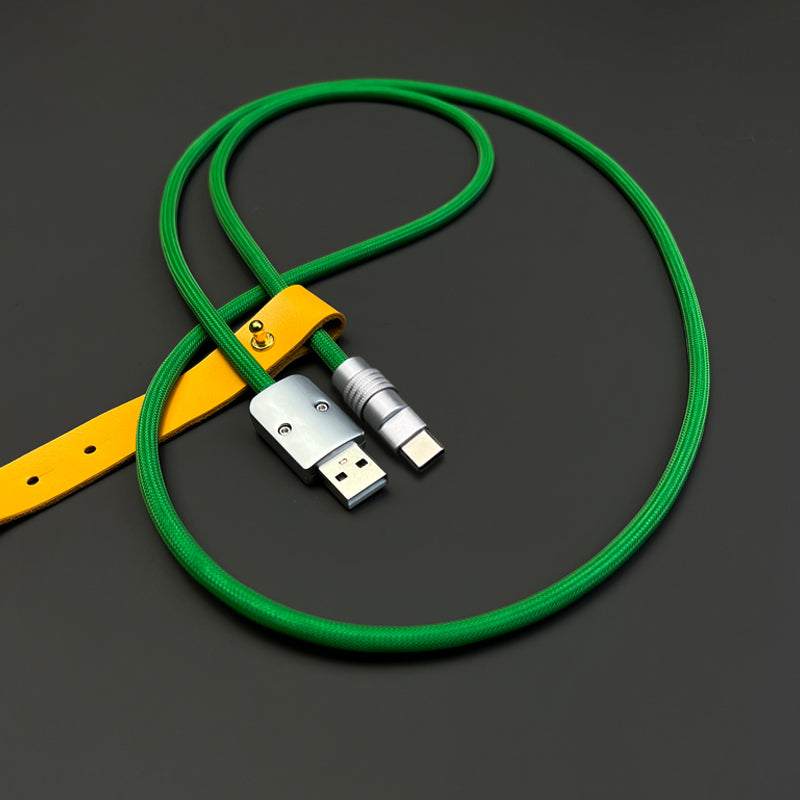 Green braided USB-A to USB-C cable with yellow organizer belt.