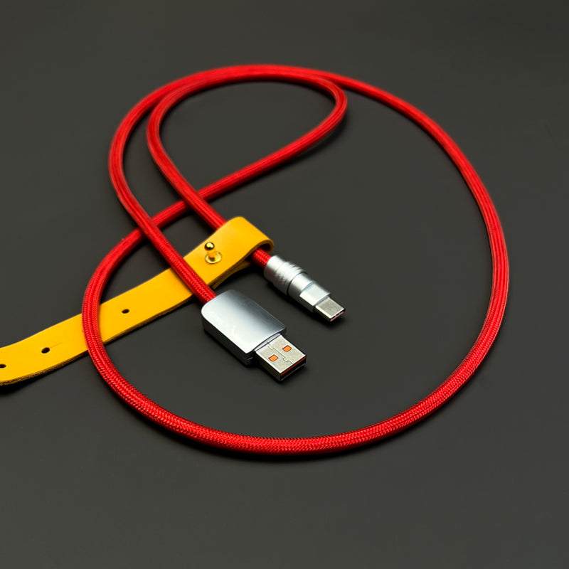 Red braided USB to Type-C fast charging cable with yellow leather strap.