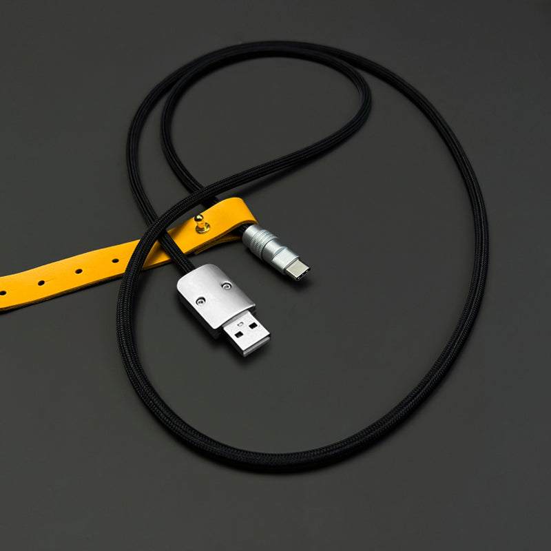 Black braided USB-A to USB-C Chubby Cable with yellow leather strap.