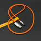 Orange braided USB charging cable with yellow leather organizer strap.