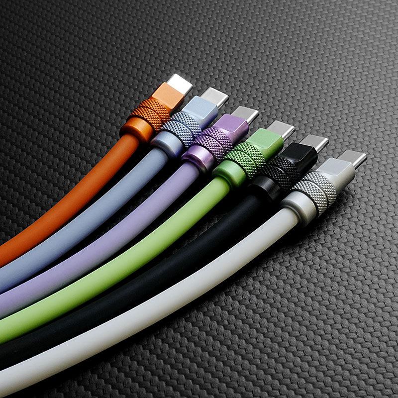 Collection of colorful 240W silicone fast charging cables with anodized metal connectors in orange, purple, green, white, and black.