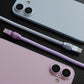 Close-up of a purple 240W silicone fast charging cable with a durable anodized connector next to an iPhone.