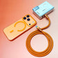 Vibrant orange 240W silicone cable paired with a matching orange magnetic power bank and iPhone case.