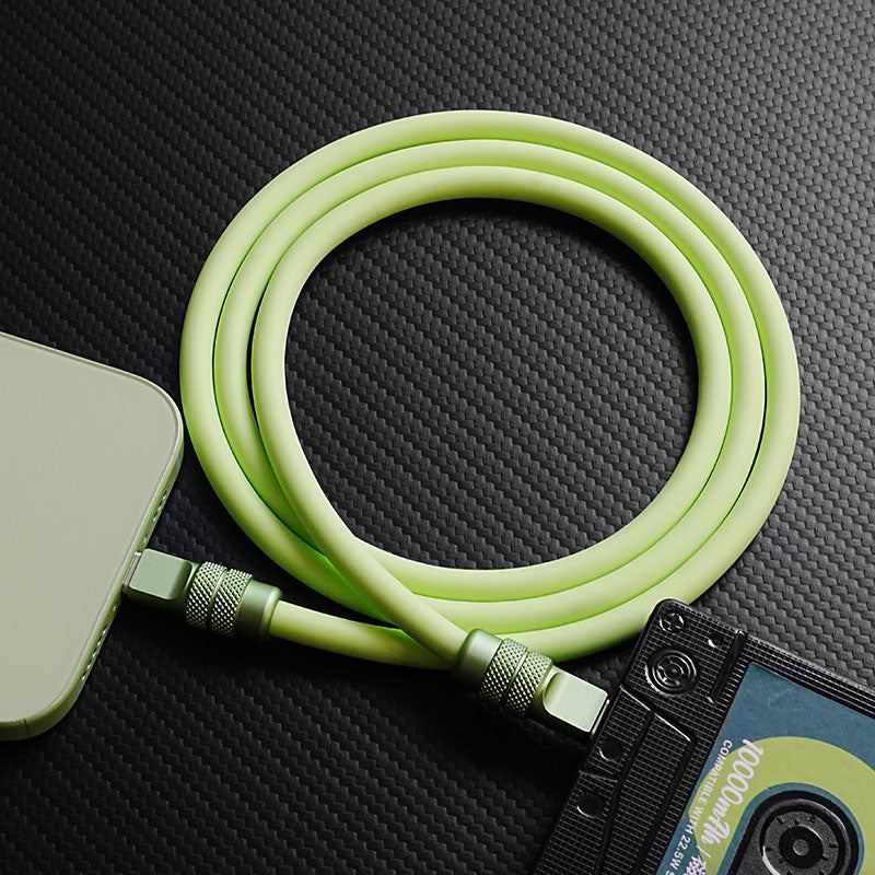 Light green coiled 240W silicone charging cable with high-quality anodized connectors.