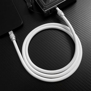 White silicone type-c fast charging cable connected to phone and power bank.