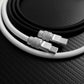 Close-up of black and white USB-C cables with premium metal connectors.