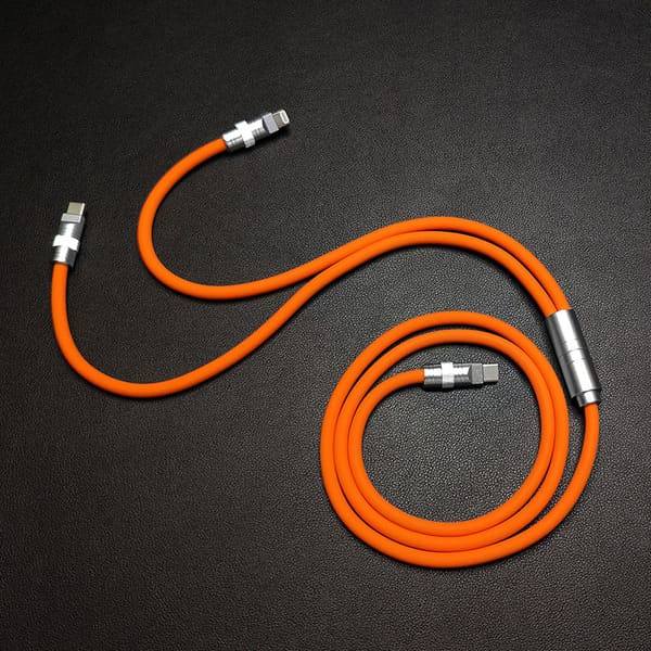 Durable orange multi-head charging cable spread on black texture.