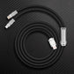 Coiled matte black multi-head charging cable with metal connectors.