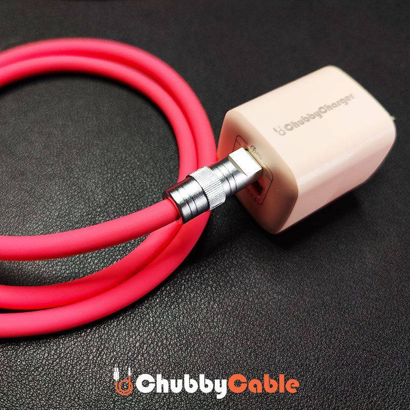 Thick red ChubbyCable plugged into a white ChubbyCharger wall adapter