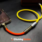 Orange Chubby Cable audio jack connected to phone playing music