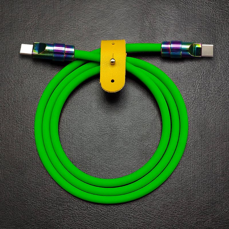 Green silicone USB-C to USB-C cable with rainbow titanium finish connectors.
