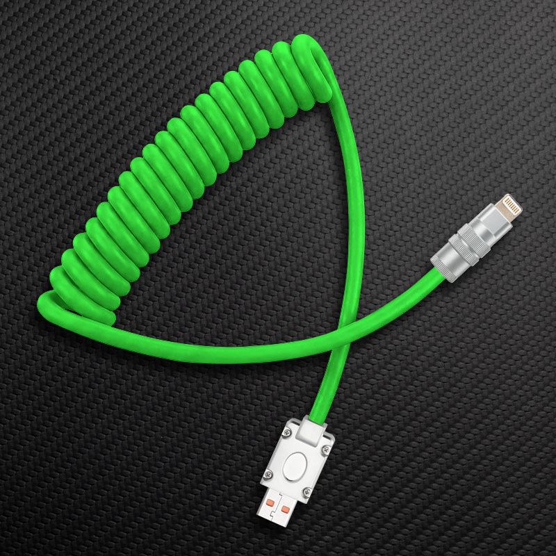 Green coiled USB to Lightning cable on carbon fiber background