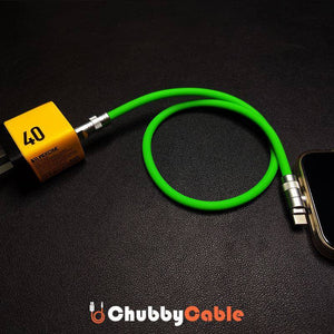 Close-up of green Chubby Cable metal interface plugged into a mobile phone