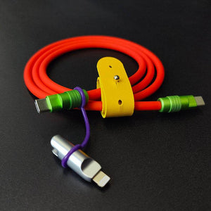 Red USB-C fast charging cable with green metal connectors and iPhone adapter.