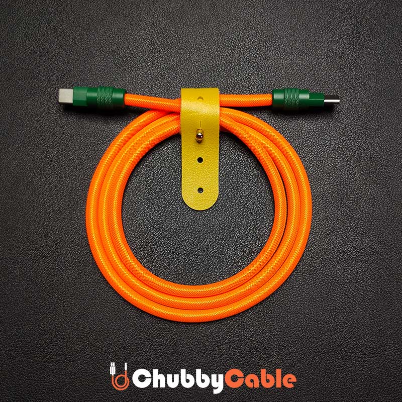 Orange braided Chubby Cable USB-C with dark green connectors and yellow leather strap