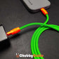 Green braided Chubby Cable with orange connectors charging a phone from a power adapter