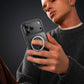 Person holding black ChubbyArmor phone case with finger ring stand