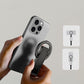 Hands attaching magnetic tripod to smartphone