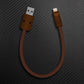 Brown USB-A to Lightning charging cable with dark brown connectors.