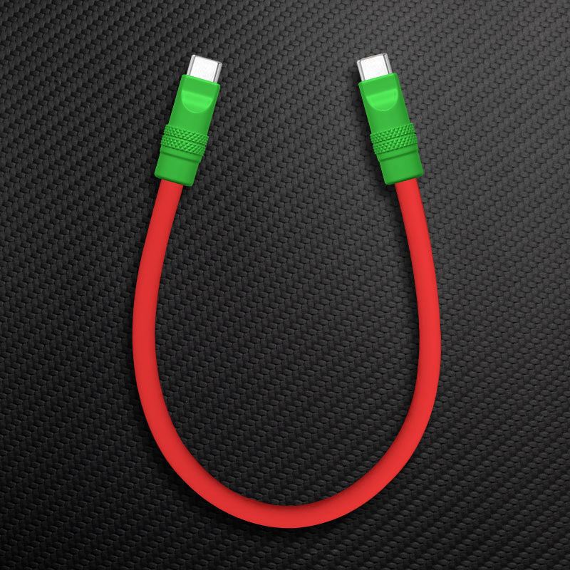 Red silicone short USB C to USB C charging cable with green ends.