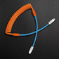 Orange coiled custom keyboard cable with light blue extension and Type-C connectors.
