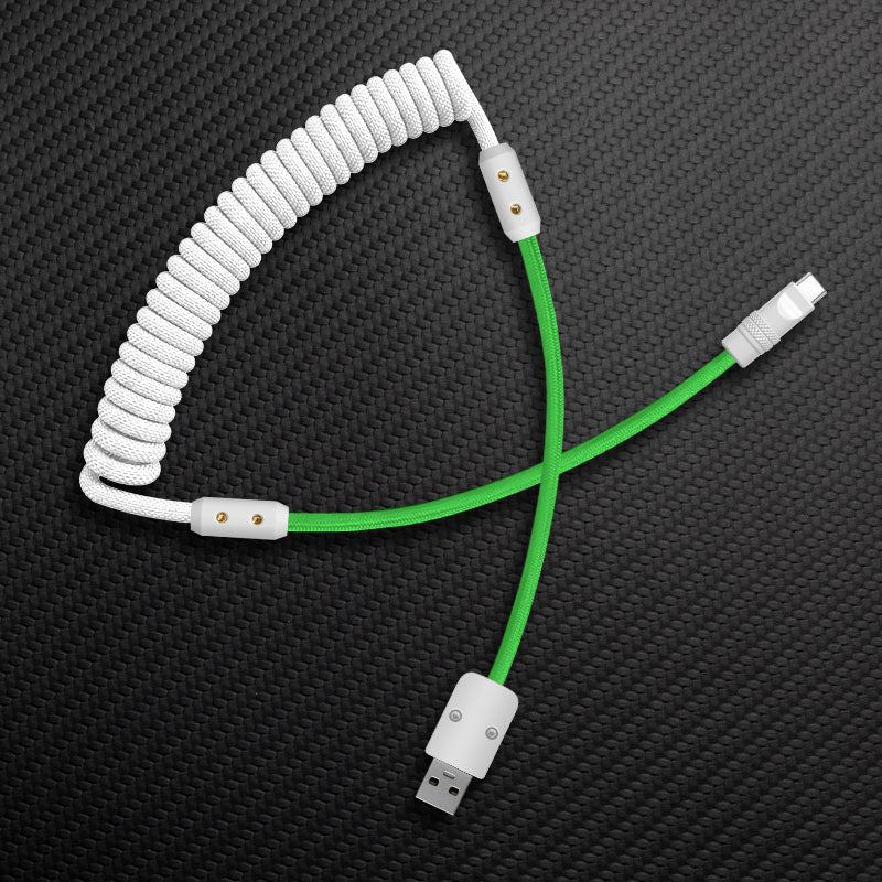 White coiled mechanical keyboard cable with green extension and USB-A to Type-C connectors.