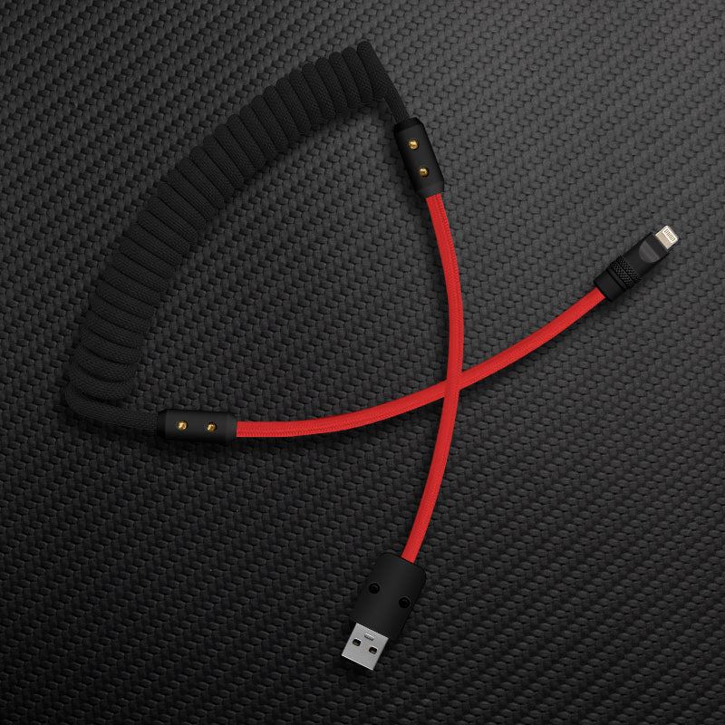 Black and red coiled colorblock charging cable with USB-A and Lightning connectors.