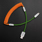Orange and green coiled Lightning to USB-A cable