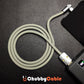 Coiled grey silicone right-angle charging cable connected to power bank
