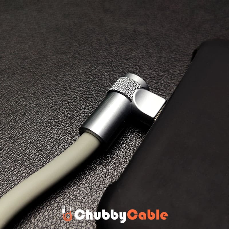 Close-up of 90-degree right-angle metal USB-C connector plugged into phone