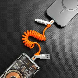 Orange coiled universal charging cable connected between power bank and smartphone.