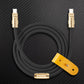 Black USB-C to USB-C charging cable with gold connectors and leather strap