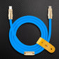 Blue USB-C to Lightning cable with gold connectors and yellow leather strap