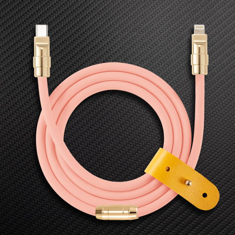 Pink USB-C to Lightning cable with gold connectors and yellow leather strap