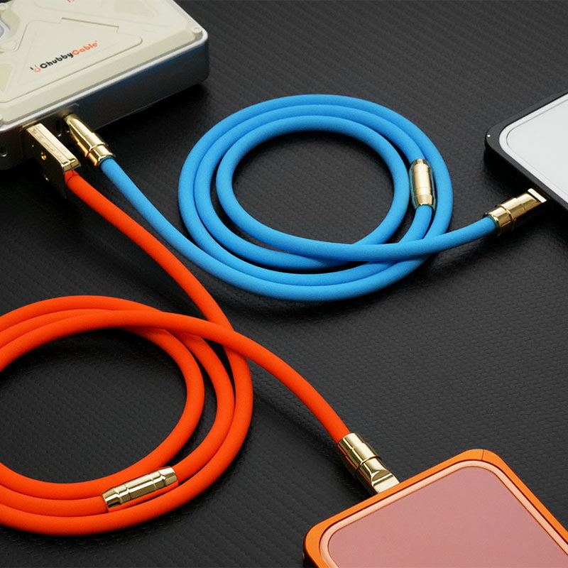 Orange and blue silicone charging cables connected to a power bank.
