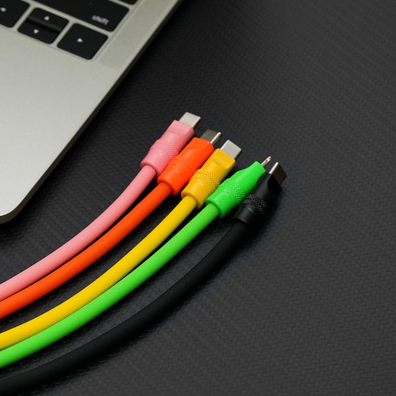Colorful lineup of pink, orange, yellow, green, and black silicone charging cables.