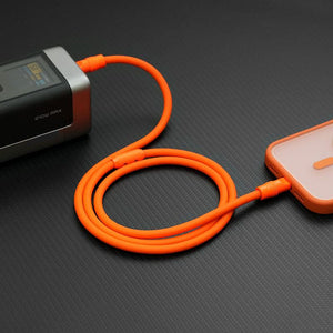 Orange heavy-duty Chubby Cable connecting a high-power power bank to a smartphone.