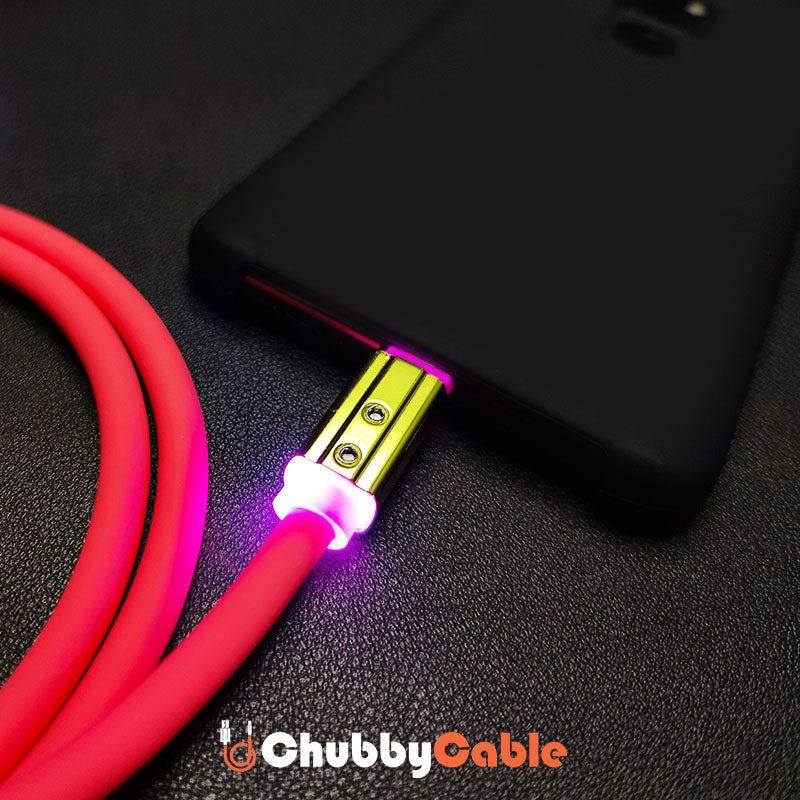 Pink glowing heavy duty charging cable plugged into a smartphone