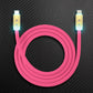 Pink Type-C to Lightning charging cable with glowing LED gold connectors.