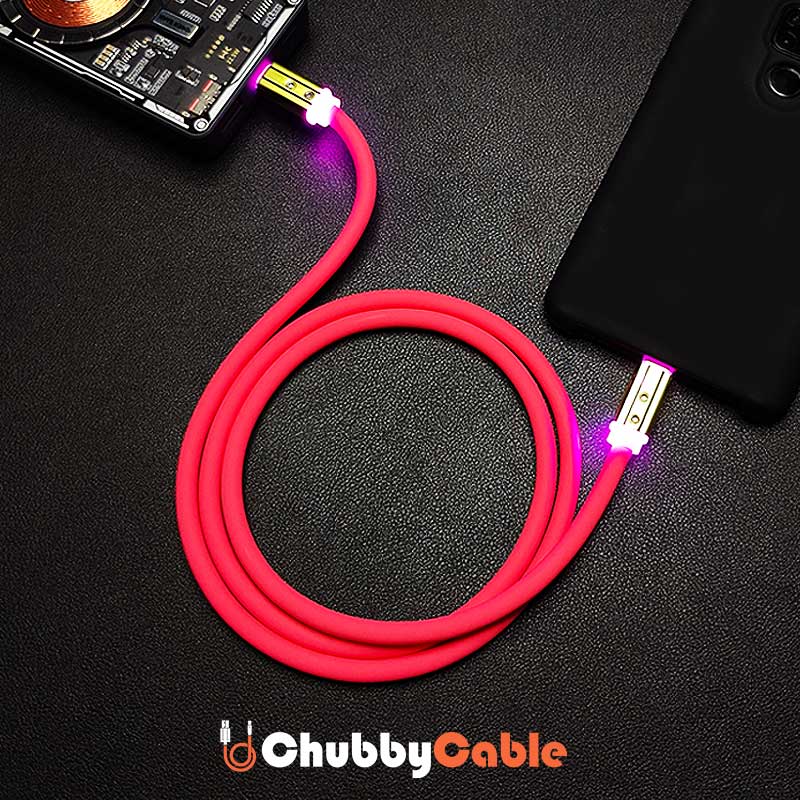 Pink flexible silicone data cable charging a phone from a power bank