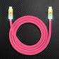 Pink USB-C to USB-C power delivery cable with illuminated gold metal heads.