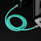 Mint green USB-C cable connecting power bank to laptop