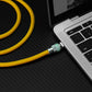 Yellow heavy duty USB-C cable plugged into laptop port