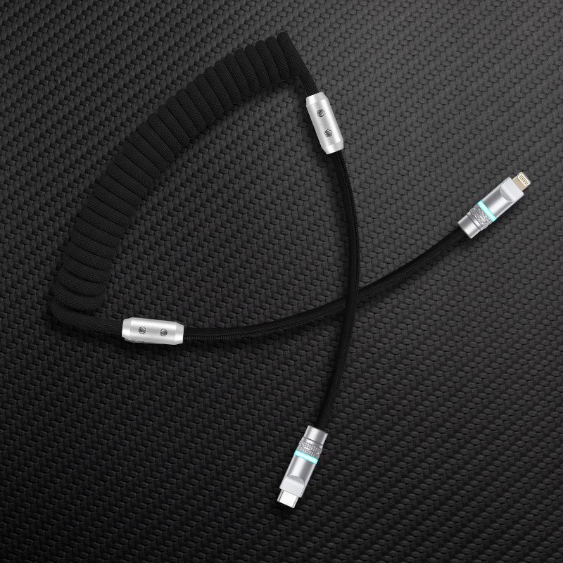Black coiled cable with black straight segment and USB-C to Lightning connector