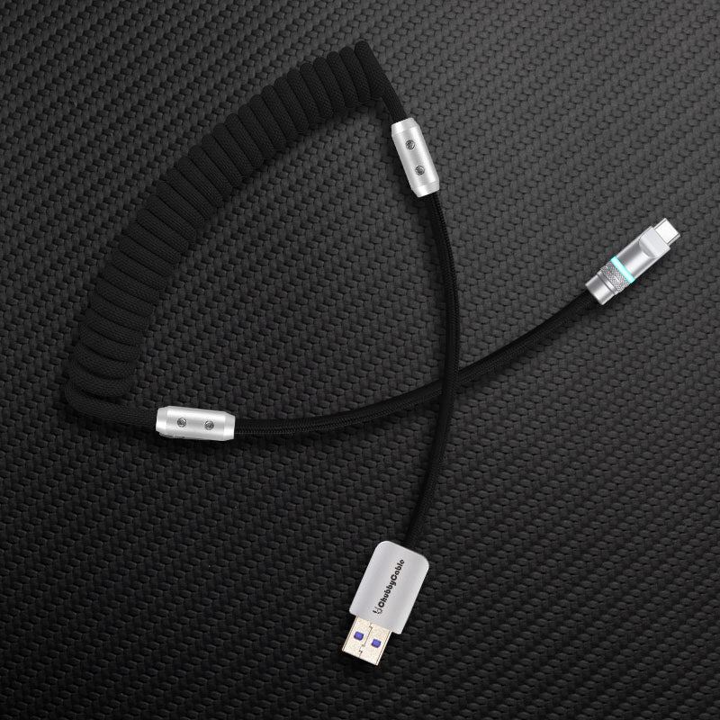 Black coiled cable with black straight segment and USB-A to USB-C connector