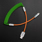 Green coiled cable with orange extension and USB-A to Lightning connector