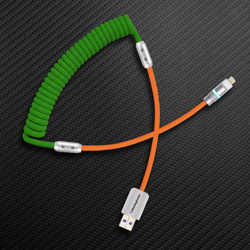 Green coiled cable with orange extension and USB-A to Lightning connector